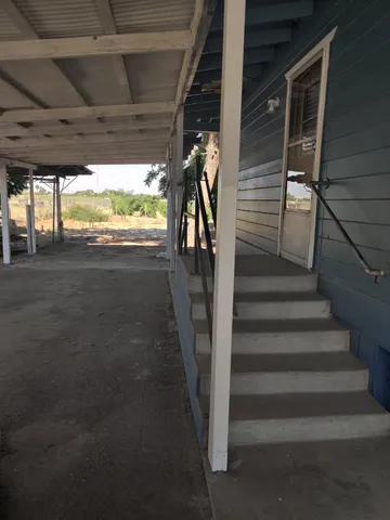 an empty room that has a window in it