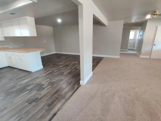 a view of cabinets and wooden floor