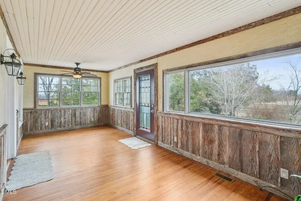 a bathroom with a sink a mirror and a shower