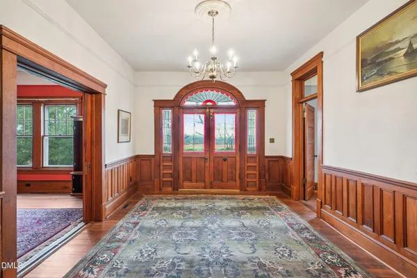 a view of an entryway with wooden floor