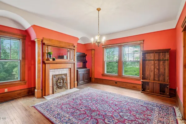 a large kitchen with stainless steel appliances granite countertop a stove and a view of living room