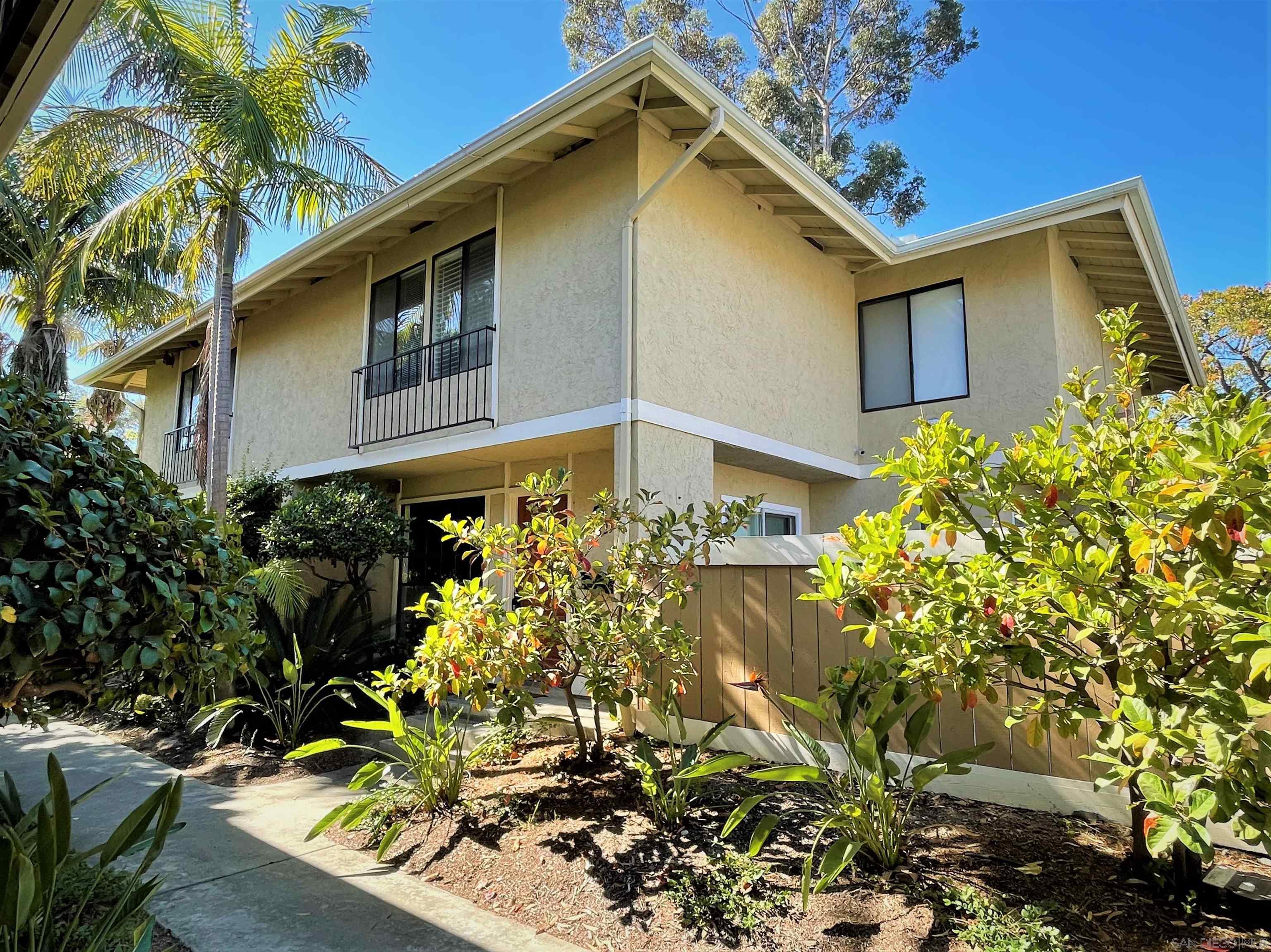 4323 Caminito Del Zafiro, Unit 74 San Diego, CA 92121 - Photo 1 of 17 a front view of a house with a yard