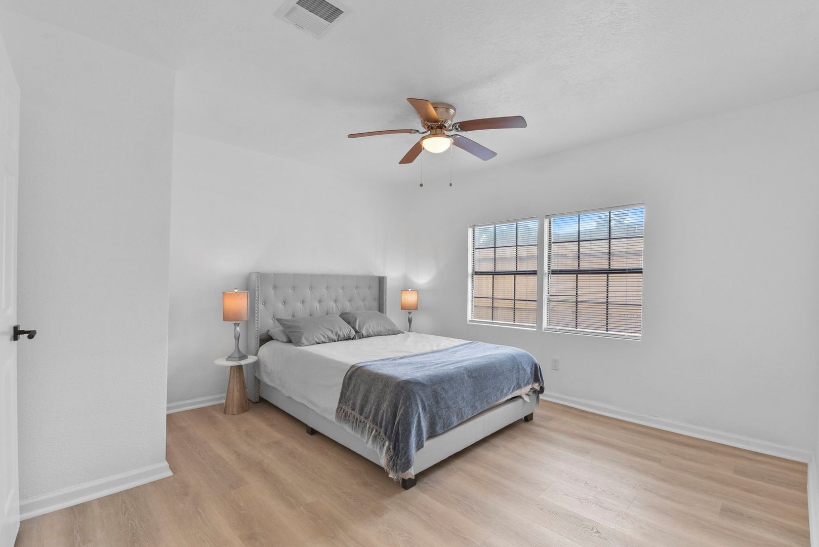 5530 Malmedy Road Houston, TX 77033 - Photo 11 of 23 a bedroom with a bed and window