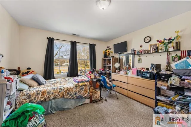 a bed room with furniture and a window