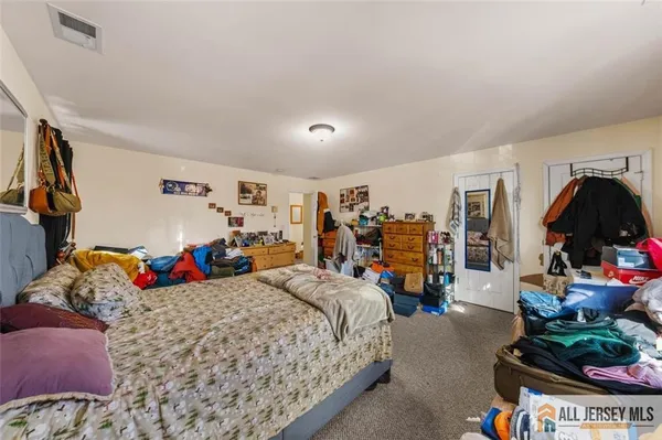 a bed room with a bed and a desk