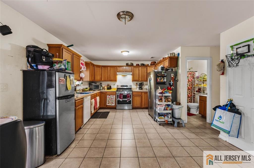 643 Drake Avenue Middlesex, NJ 08846 - Photo 9 of 28 a kitchen with stainless steel appliances granite countertop a refrigerator and a sink