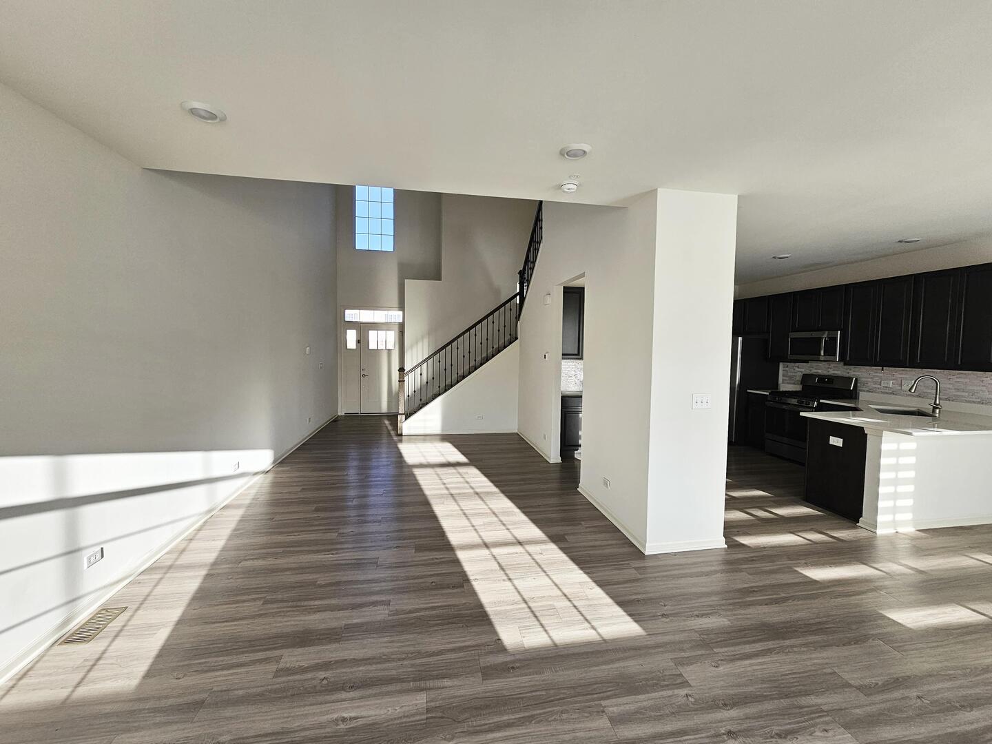 2049 Stuttle Road Batavia, IL 60510 - Photo 5 of 14 a view of a kitchen with wooden floor and electronic appliances