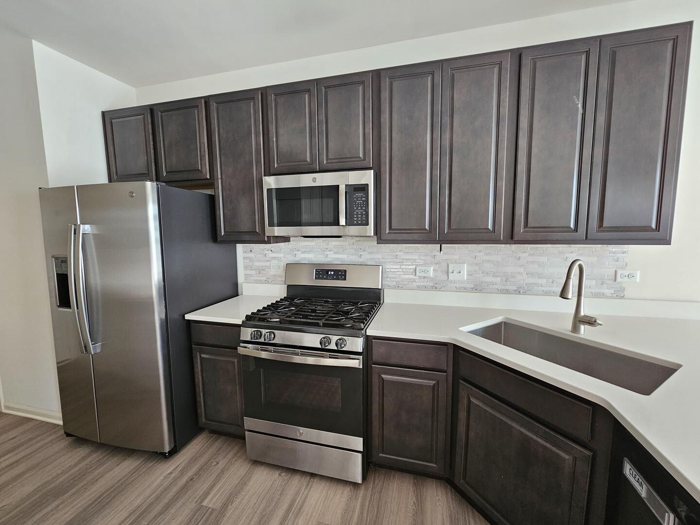 2049 Stuttle Road Batavia, IL 60510 - Photo 6 of 14 a kitchen with granite countertop wooden cabinets stainless steel appliances and a sink