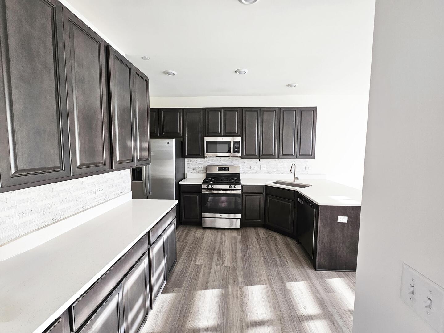 2049 Stuttle Road Batavia, IL 60510 - Photo 7 of 14 a kitchen with a refrigerator stove and sink