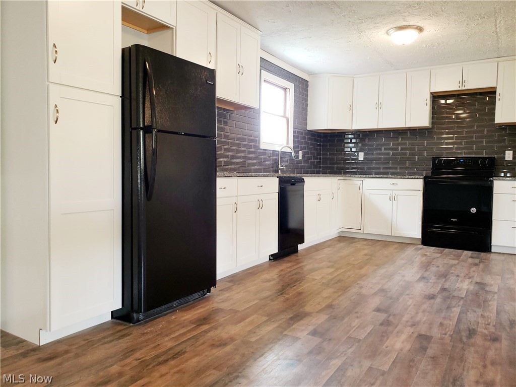 9113 Kettering Road Kensington, OH 44427 - Photo 10 of 24 Brand new Kitchen with granite counter tops tile back splash and new appliances
