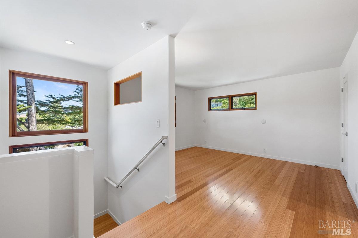 216 Reed Street Mill Valley, CA 94941 - Photo 12 of 17 a view of empty room with wooden floor and window