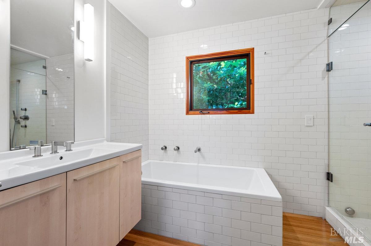216 Reed Street Mill Valley, CA 94941 - Photo 13 of 17 a bathroom with a tub sink and mirror