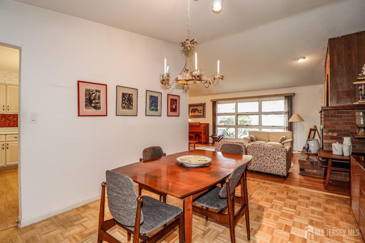 12 Buchanan Road Metuchen, NJ 08840 - Photo 11 of 42 a dining room with furniture and chandelier