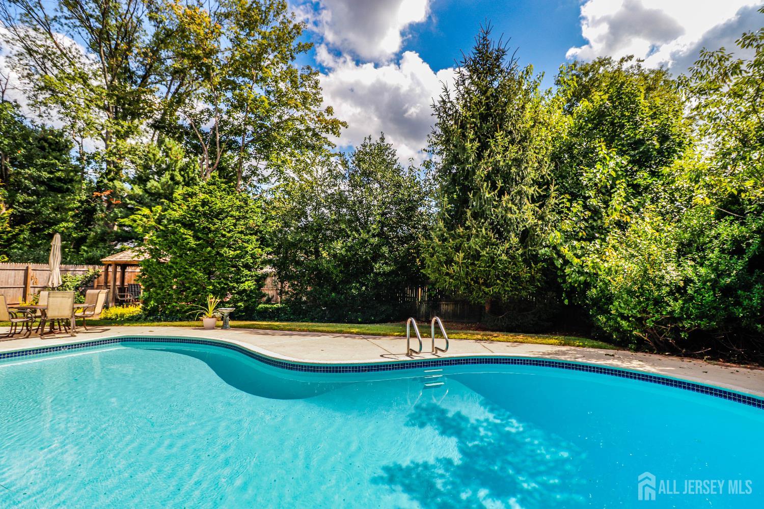 12 Buchanan Road Metuchen, NJ 08840 - Photo 31 of 42 a view of a swimming pool with an outdoor space