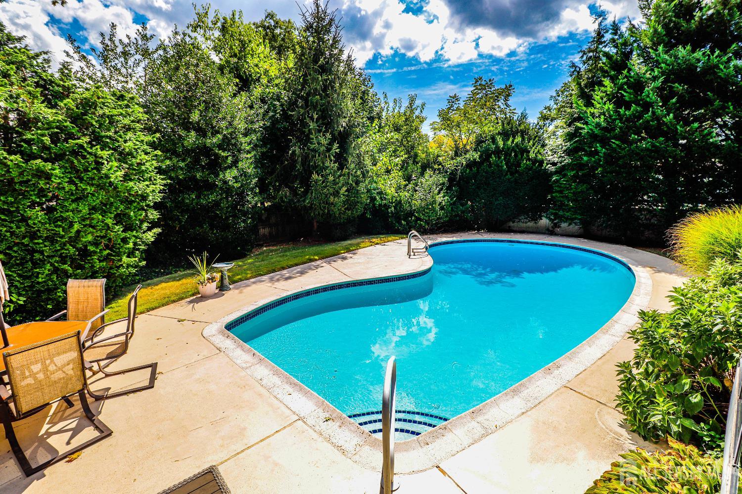 12 Buchanan Road Metuchen, NJ 08840 - Photo 34 of 42 a view of a swimming pool with a yard