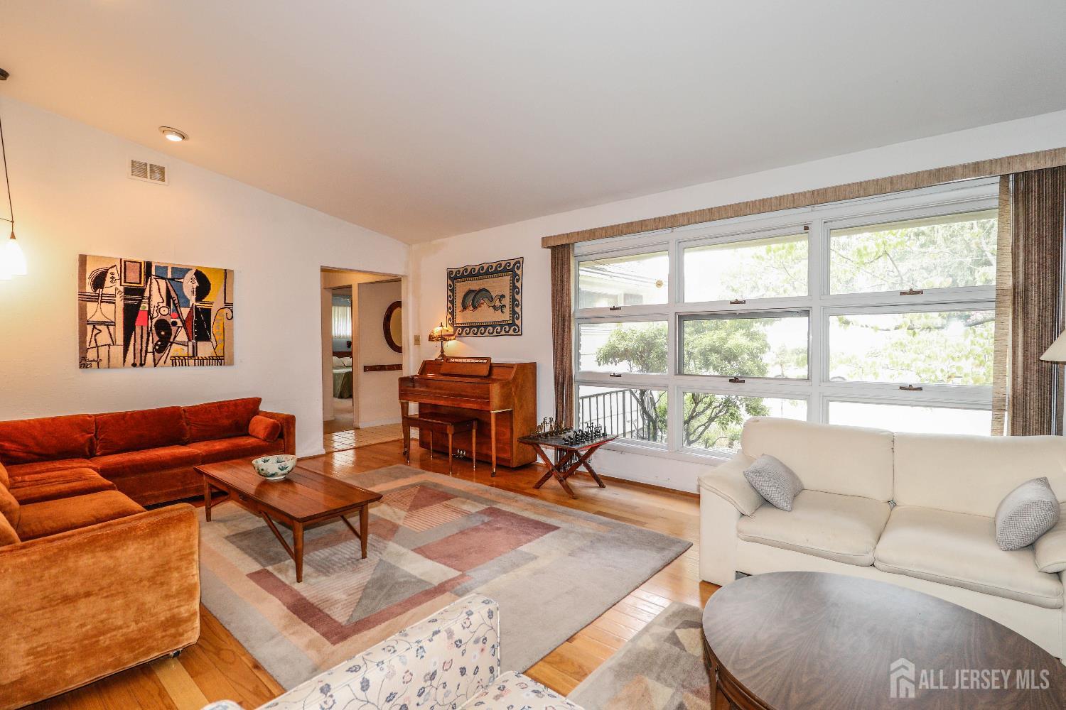 12 Buchanan Road Metuchen, NJ 08840 - Photo 8 of 42 a living room with furniture and a large window