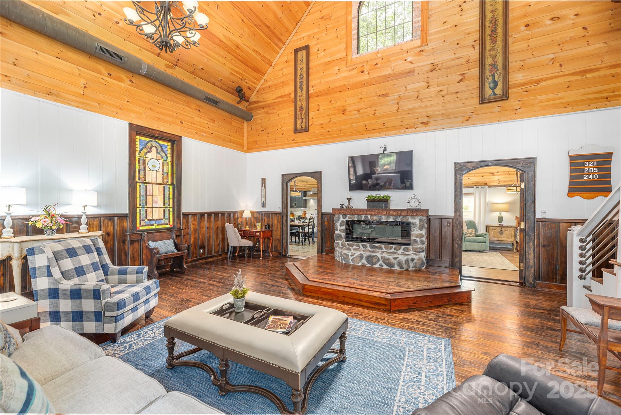 1202 Iron Duff Road Waynesville, NC 28785 - Photo 11 of 42 a living room with furniture a rug and kitchen view