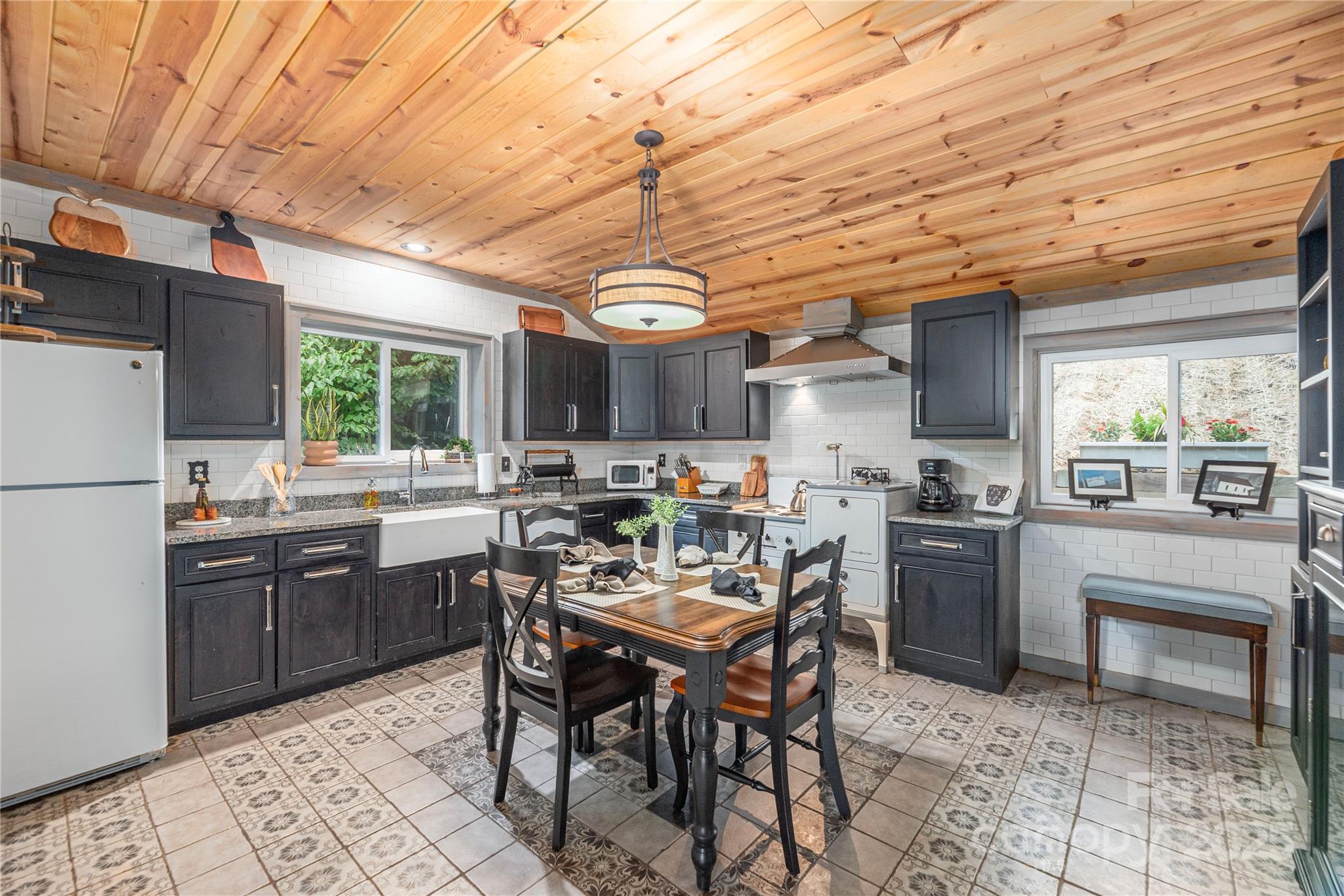 1202 Iron Duff Road Waynesville, NC 28785 - Photo 20 of 42 a kitchen with a dining table and chairs