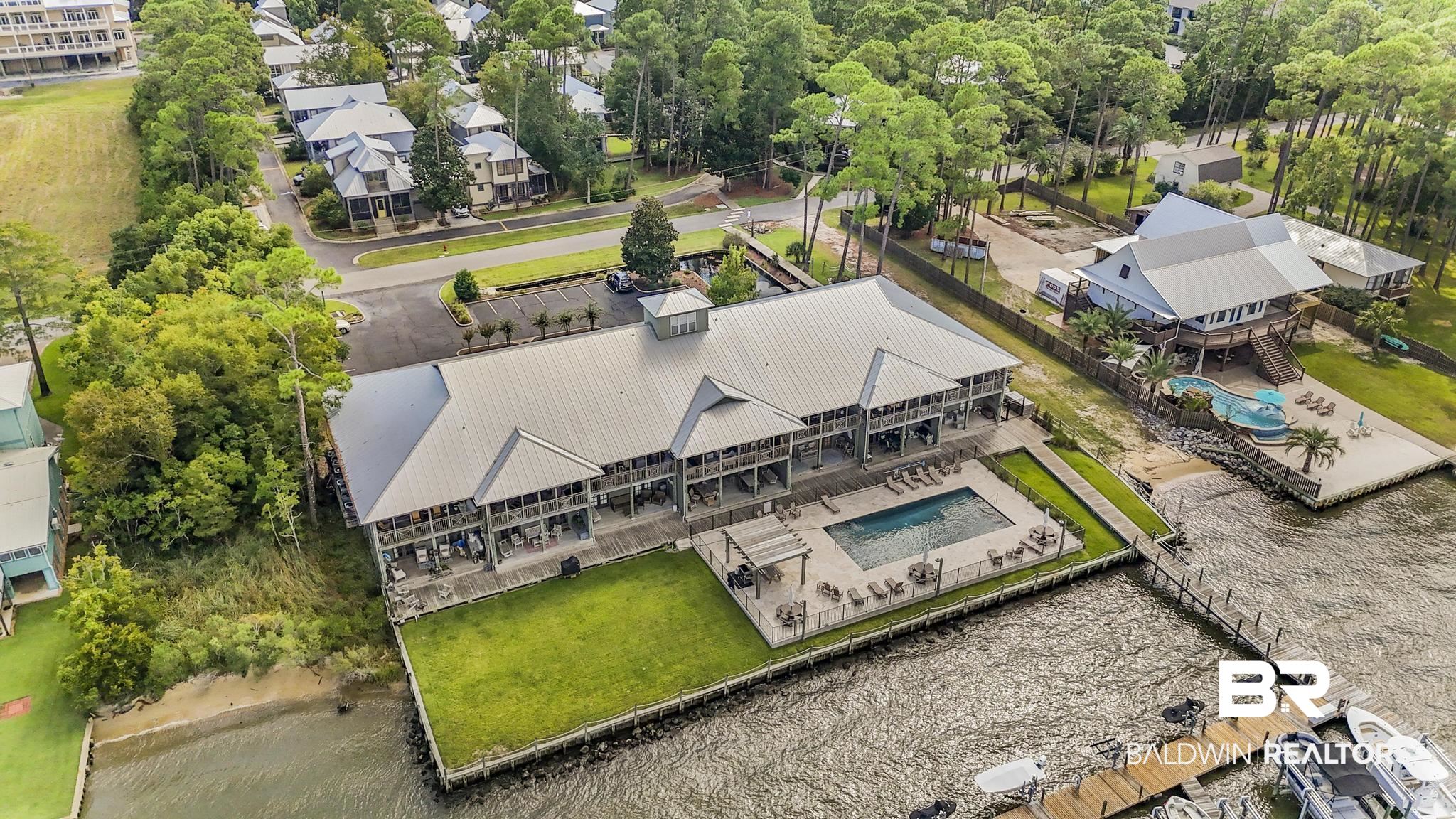 25773 Canal Road Orange Beach, AL 36561 - Photo 20 of 32 Aerial view of a pool