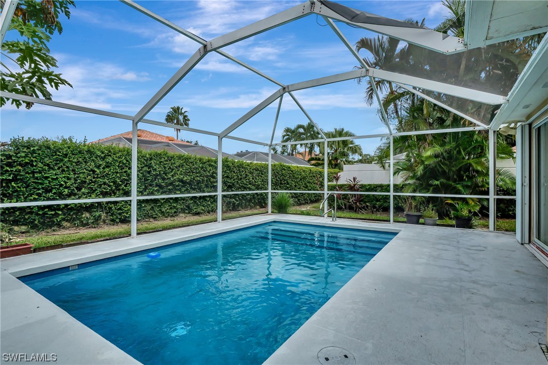5682 Eleuthera Way Naples, FL 34119 - Photo 1 of 47 a view of a backyard with a swimming pool