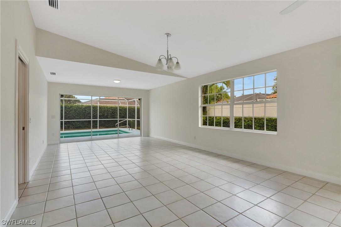 5682 Eleuthera Way Naples, FL 34119 - Photo 20 of 47 a view of an empty room with a window