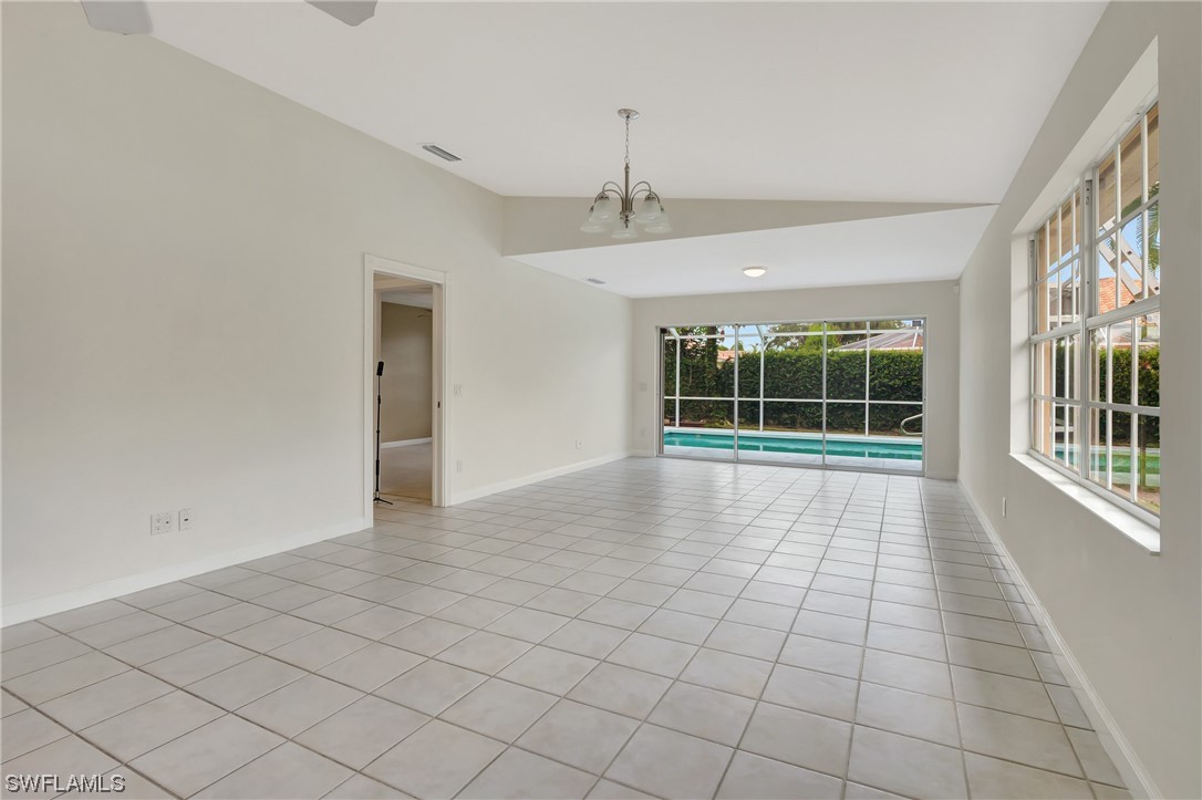5682 Eleuthera Way Naples, FL 34119 - Photo 21 of 47 a view of an empty room with a window