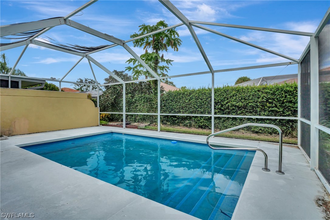 5682 Eleuthera Way Naples, FL 34119 - Photo 23 of 47 a view of a backyard with swimming pool