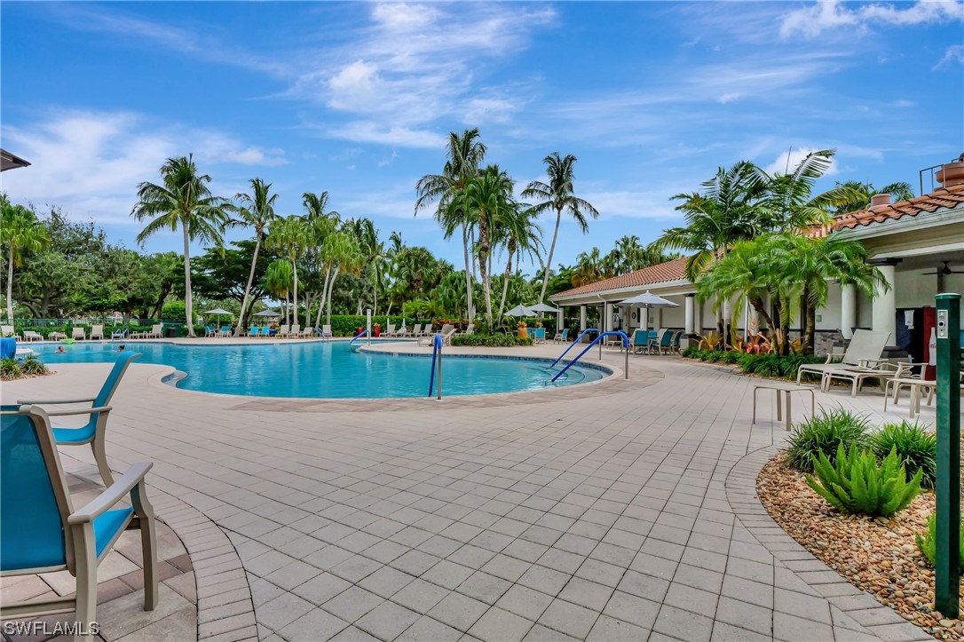 5682 Eleuthera Way Naples, FL 34119 - Photo 31 of 47 a view of a yard and a patio
