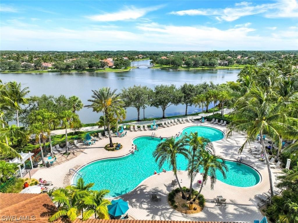 5682 Eleuthera Way Naples, FL 34119 - Photo 32 of 47 a view of a lake with a yard