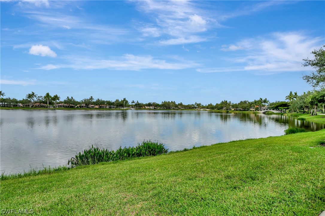 5682 Eleuthera Way Naples, FL 34119 - Photo 37 of 47 a view of a lake with houses in the back
