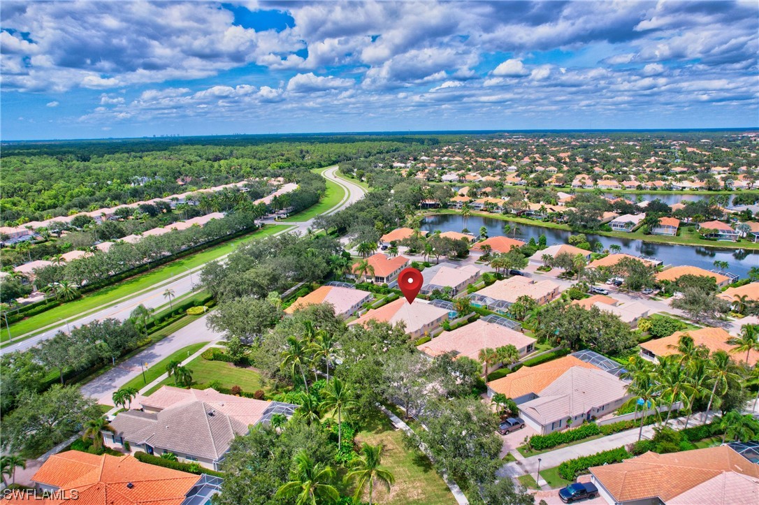5682 Eleuthera Way Naples, FL 34119 - Photo 44 of 47 an aerial view of residential houses with outdoor space and street view