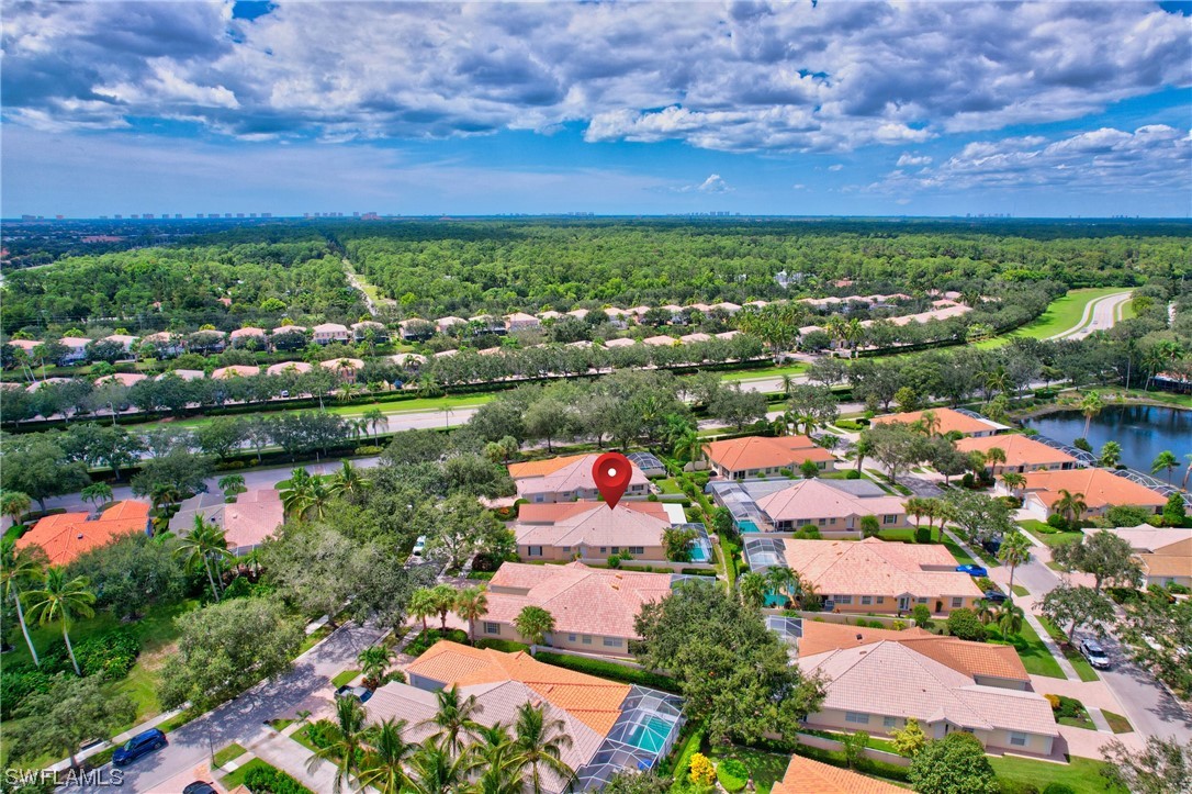 5682 Eleuthera Way Naples, FL 34119 - Photo 45 of 47 an aerial view of residential houses with outdoor space and lake view