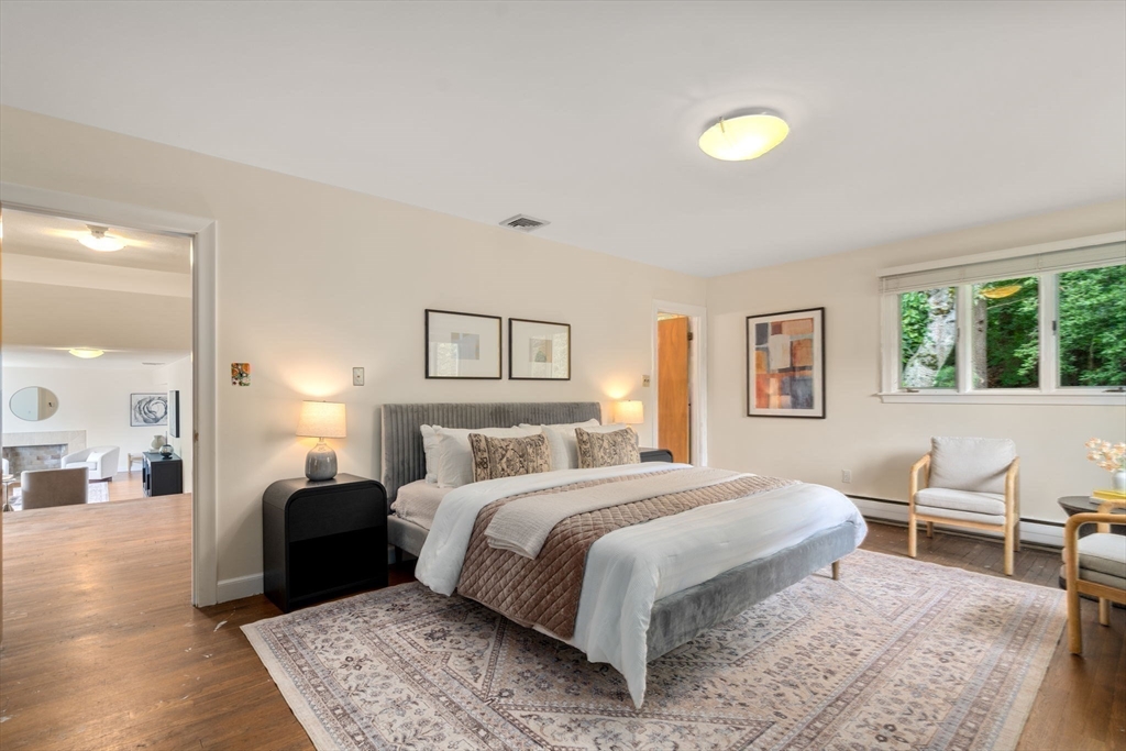 61 Sevland Road Newton, MA 02459 - Photo 11 of 27 a bedroom with a bed and wooden floor