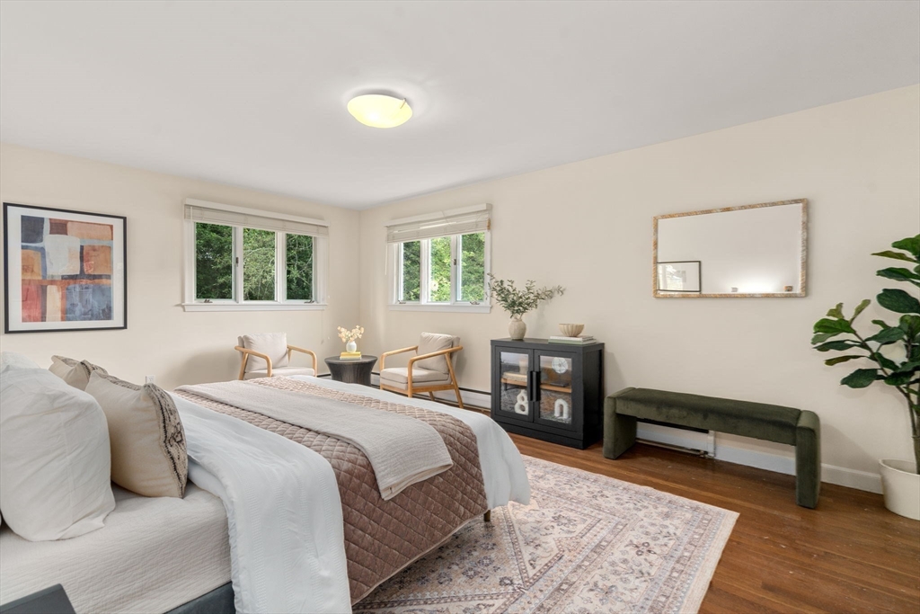 61 Sevland Road Newton, MA 02459 - Photo 12 of 27 a bedroom with a bed and wooden floor