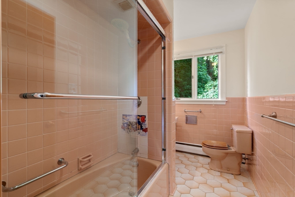 61 Sevland Road Newton, MA 02459 - Photo 16 of 27 a bathroom with a sink a toilet and shower