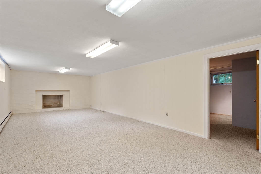 61 Sevland Road Newton, MA 02459 - Photo 19 of 27 an empty room with a empty space and windows