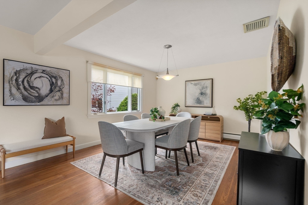 61 Sevland Road Newton, MA 02459 - Photo 5 of 27 a view of a dining room with furniture and a potted plant
