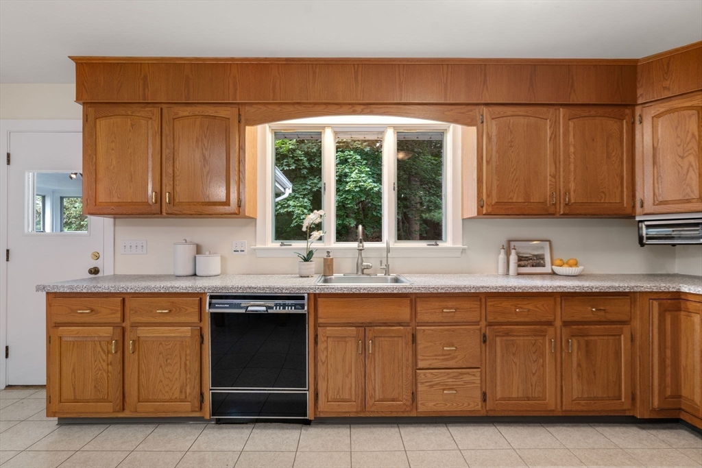61 Sevland Road Newton, MA 02459 - Photo 9 of 27 a kitchen with a sink and cabinets