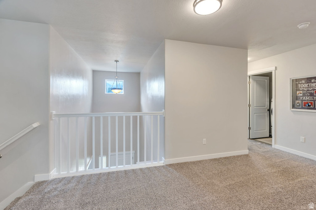 2194 Autumn Drive Mapleton, UT 84664 - Photo 40 of 41 Carpeted landing with white baluster railing, flush-mount ceiling light, and a prominent window