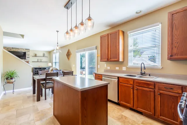 a kitchen with a sink stove and cabinets