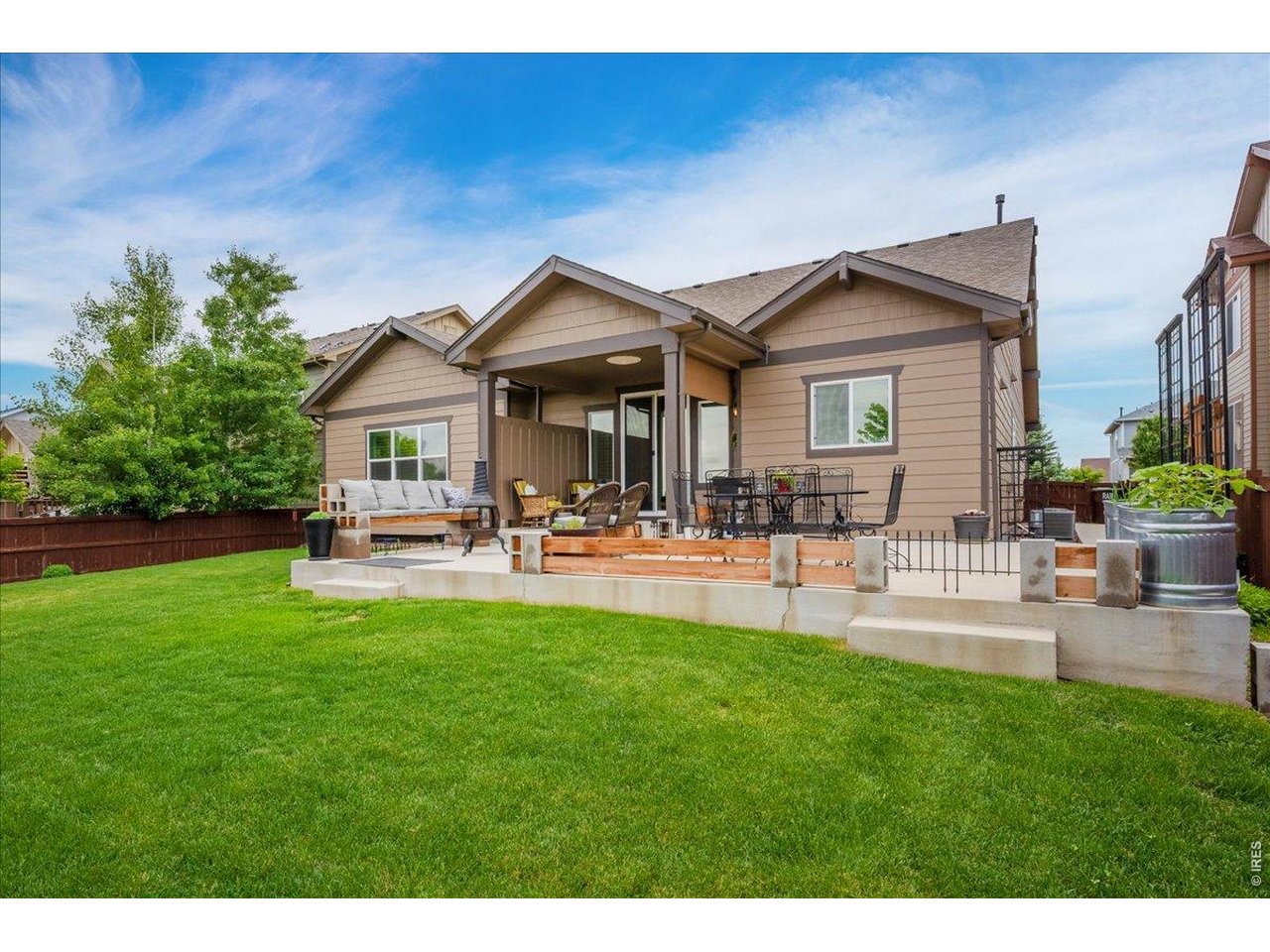 6096 Story Road Timnath, CO 80547 - Photo 42 of 50 a front view of a house with patio and garden