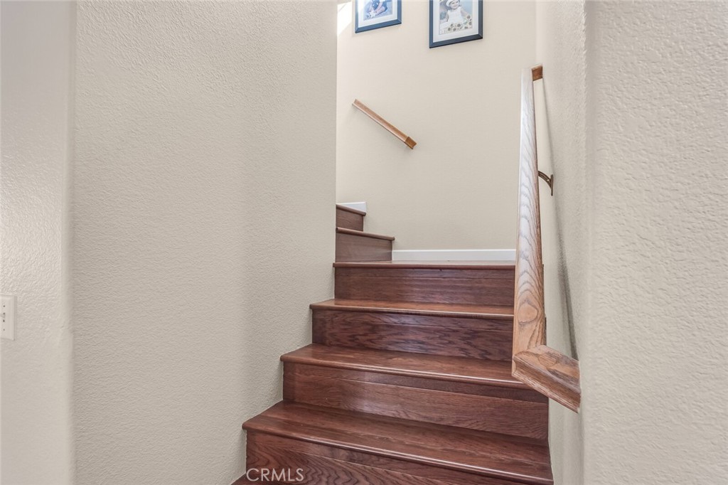 4330 Forest Ranch Way Oceanside, CA 92057 - Photo 20 of 51 Head upstairs via the wood staircase to a spacious primary suite tucked quietly at the end of the hall.