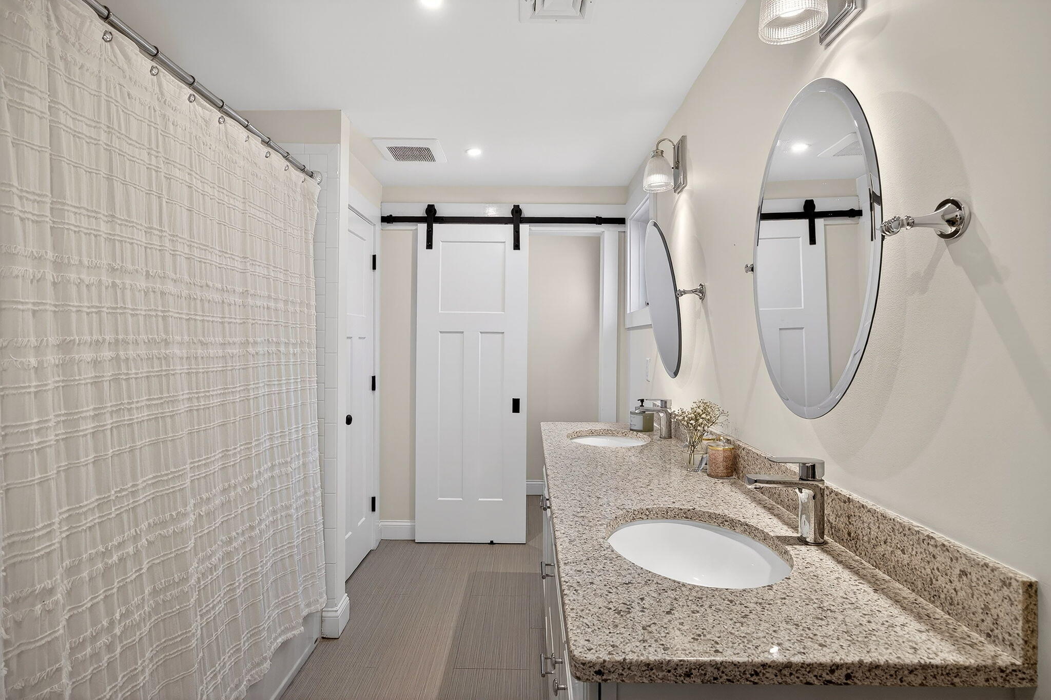 176 Bumps River Road Osterville, MA 02655 - Photo 37 of 54 a bathroom with a granite countertop sink a mirror and shower
