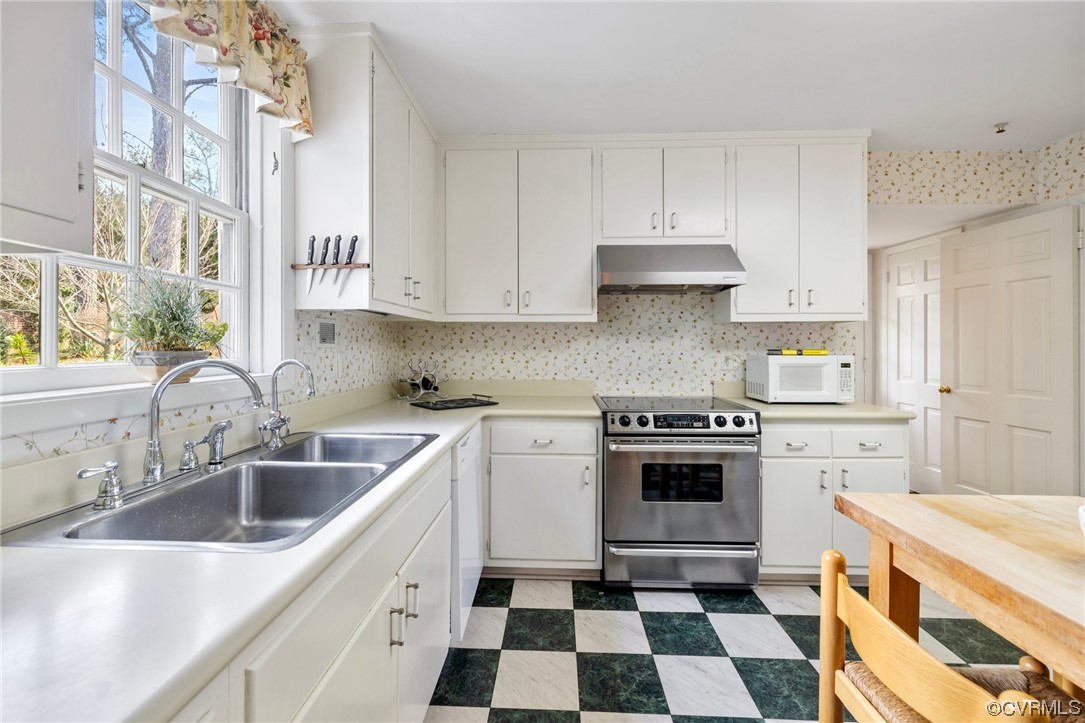 6161 River Road, Unit 1 Richmond, VA 23226 - Photo 14 of 32 a kitchen with a stove a sink and a microwave