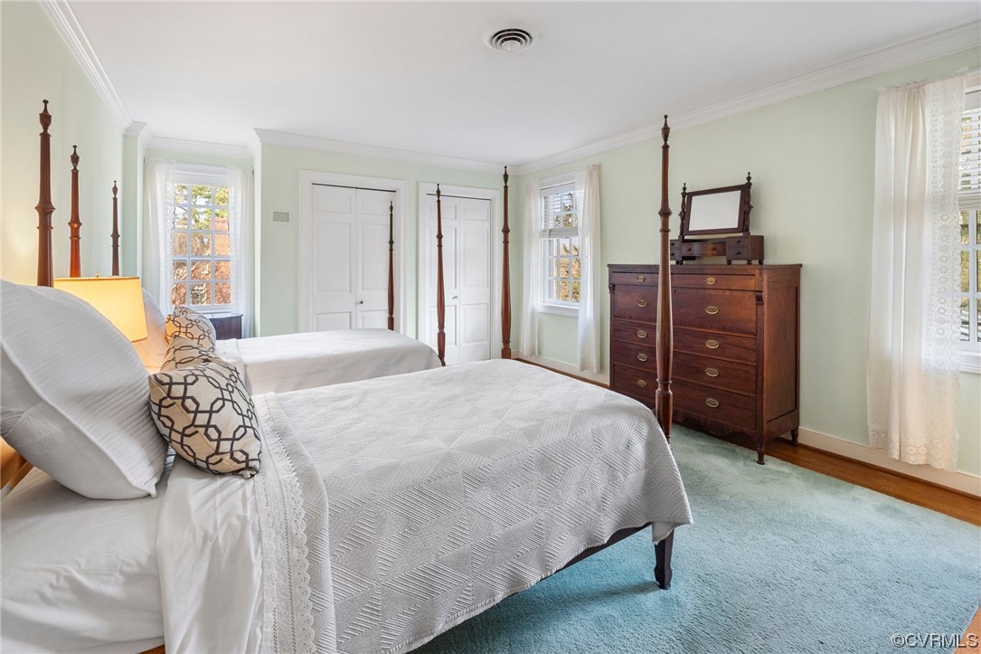 6161 River Road, Unit 1 Richmond, VA 23226 - Photo 20 of 32 a bedroom with a bed and a dresser