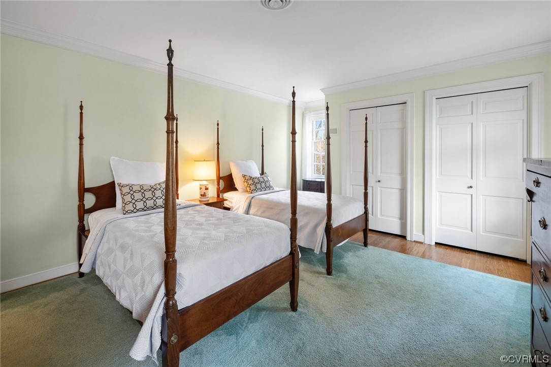 6161 River Road, Unit 1 Richmond, VA 23226 - Photo 21 of 32 a bed room with a bed and a chandelier