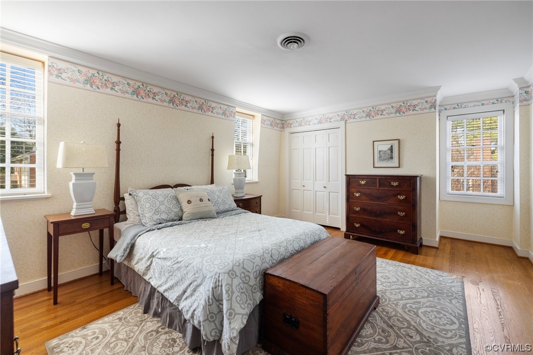 6161 River Road, Unit 1 Richmond, VA 23226 - Photo 23 of 32 a bedroom with a bed and wooden floor