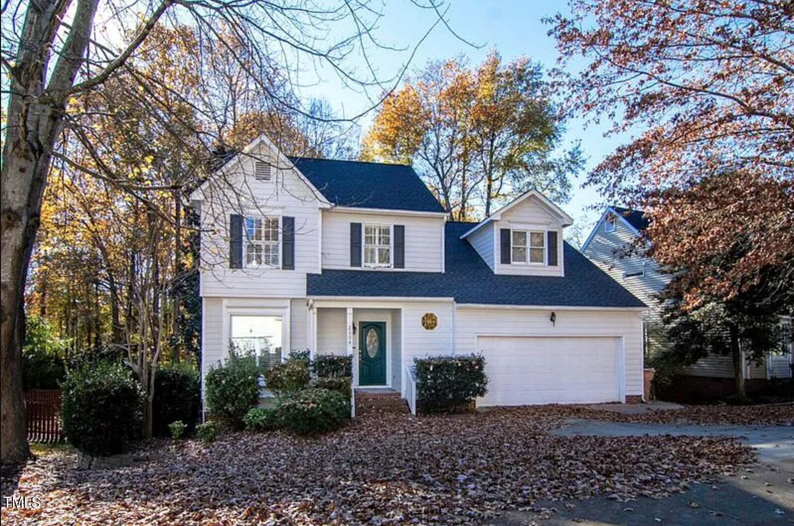 2604 Crofton Springs Drive Raleigh, NC 27615 - Photo 1 of 21 a front view of a house with garden