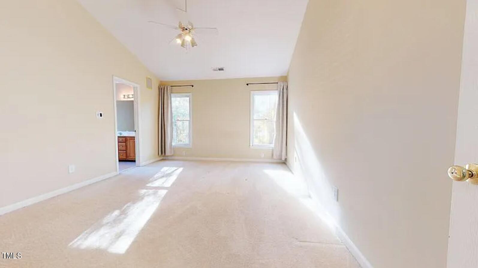 2604 Crofton Springs Drive Raleigh, NC 27615 - Photo 12 of 21 an empty room with windows and cabinet