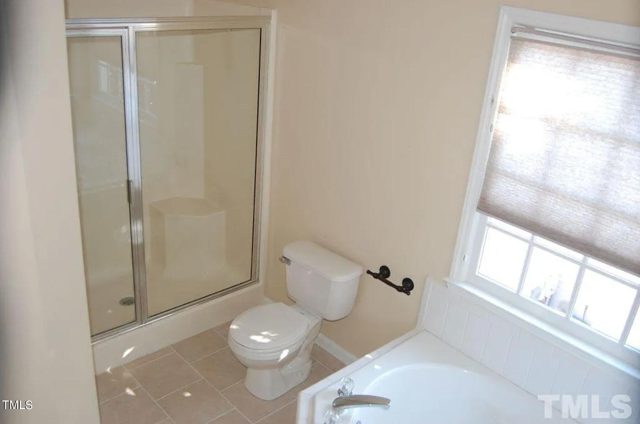2604 Crofton Springs Drive Raleigh, NC 27615 - Photo 15 of 21 a bathroom with a sink and a toilet